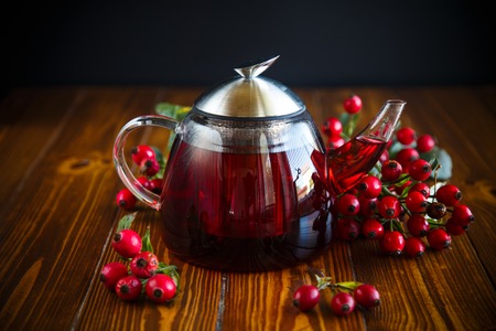 rose hip tea on a wooden backgroundの写真素材