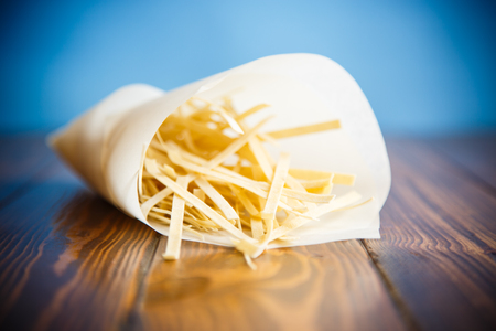 homemade egg noodles in a paper packageの写真素材