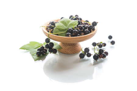 ripe berries black currant on white background