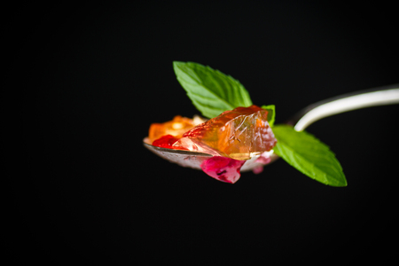 sweet multi-colored jelly on a black backgroundの写真素材