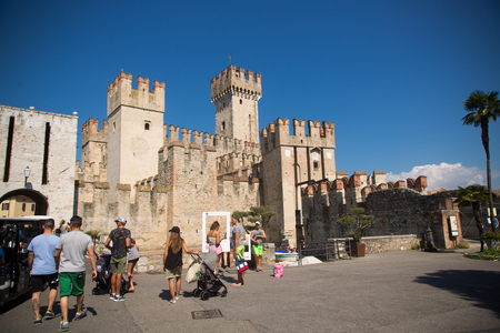 September 7 2018. Sirmione, province of Brescia, northern Italy. medieval castle Scaliger on lake Lago di Gardaのeditorial素材