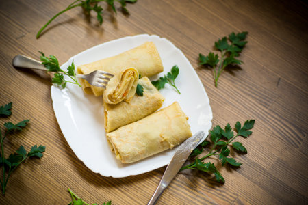 thin fried pancakes stuffed with stewed cabbage in a plate