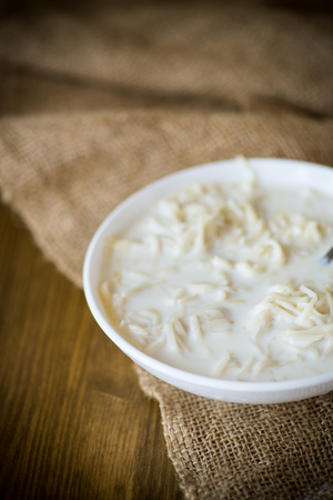 homemade sweet noodles with milk in a plateの写真素材