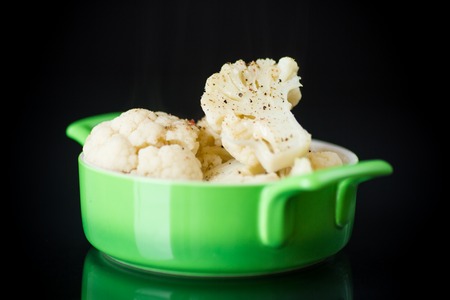 boiled cauliflower with spices in a bowlの写真素材