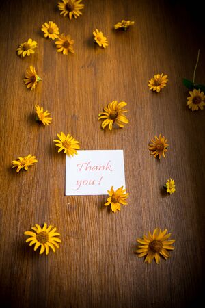 bouquet of yellow big daisies on a woodenの写真素材
