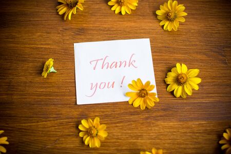 bouquet of yellow big daisies on a woodenの写真素材