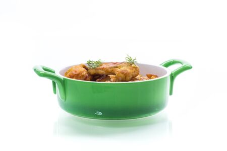 chicken fried in batter with dill on a plate,isolated on white backgroundの写真素材