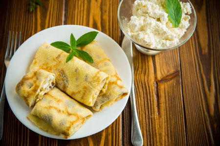 sweet fried thin pancakes with cottage cheese insideの写真素材