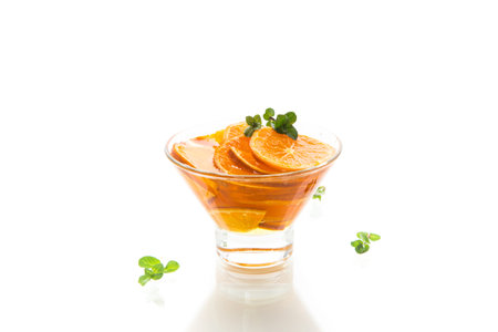 sweet tangerine syrup in a glass bowl on a wooden table
