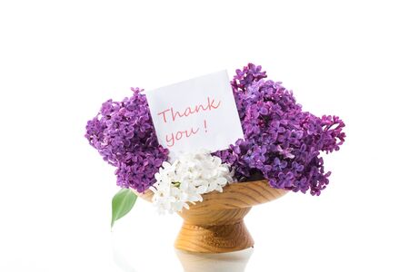 bouquet of beautiful blooming lilacs in a vase isolated on white backgroundの写真素材