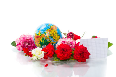 Globe with books and flowers on a white background