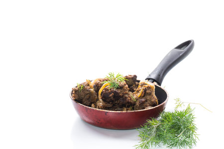 Beef liver fried with onions and herbs