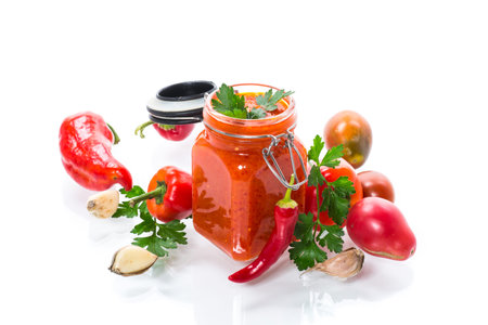 fresh natural homemade sauce made of peppers, tomatoes and other vegetables