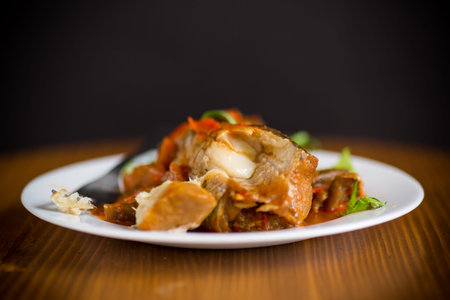 whole fish hake stewed with carrots, beets, peppers and other vegetables.