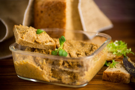 homemade meat pate with homemade bread on a wooden table