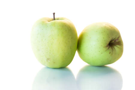 two ripe green apple isolated on white backgroundの写真素材