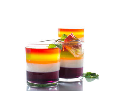 lot of colored sweet fruit jelly in a glass isolated on white backgroundの写真素材
