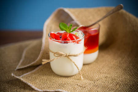 homemade sweet yogurt with fruit jelly piecesの写真素材