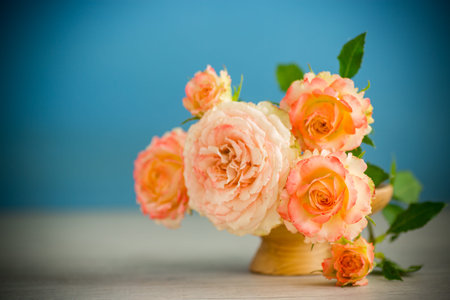 bouquet of beautiful roses on a wooden table