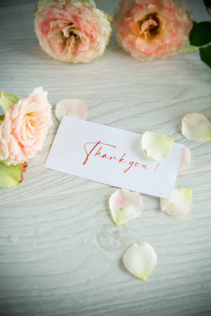 bouquet of beautiful roses on a wooden table