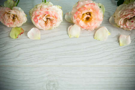 bouquet of beautiful roses on a wooden tableの写真素材