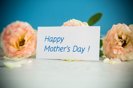 bouquet of beautiful roses on a wooden tableの写真素材