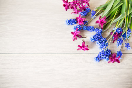 beautiful bouquet of spring flowers on a wooden table, rustic style.の写真素材