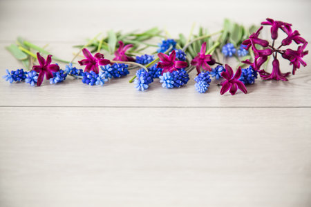 beautiful bouquet of spring flowers on a wooden table, rustic style.の写真素材