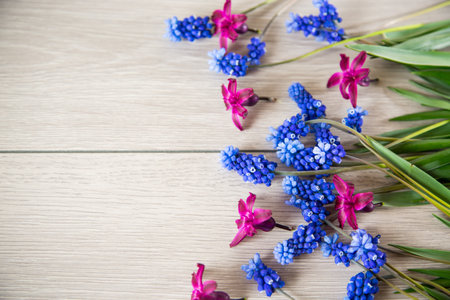beautiful bouquet of spring flowers on a wooden table, rustic style.の写真素材