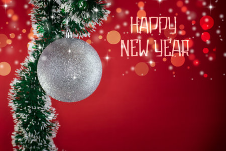 New Year's toys, decorations and other items on a red abstract background. New Year background.の写真素材
