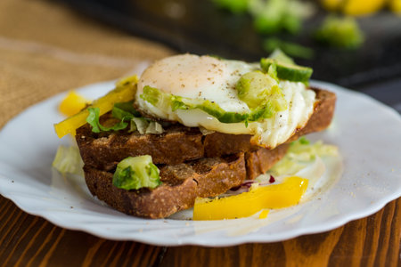 Homemade toast with colorful vegetables.