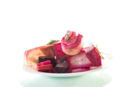 pickled cabbage with beets and carrots, in a plate, isolated on white background.の写真素材
