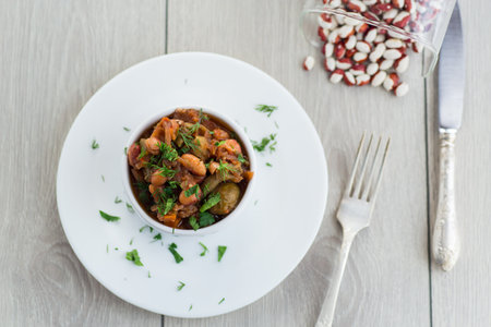 beans cooked with Brussel sprouts, tomatoes and other vegetables.の写真素材