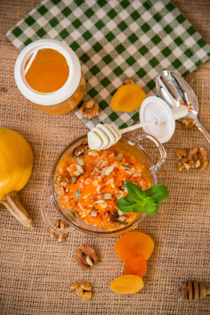 Cooked rice with pumpkin, honey and nuts.の写真素材