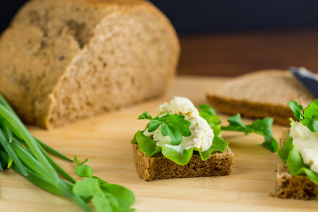 Healthy breakfast with rye bread and vegetable spread.