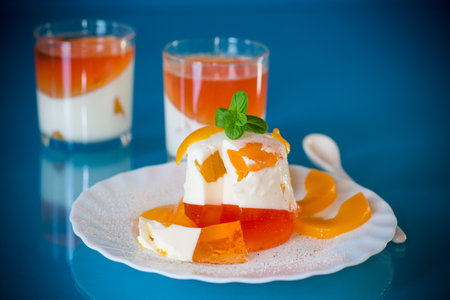 Portioned jelly dessert with yogurt cream and fruits.の写真素材