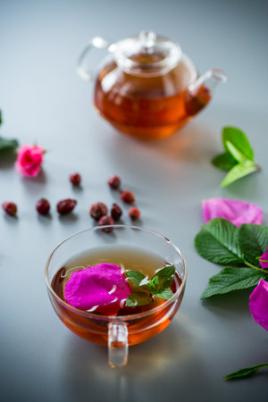 Aromatic natural drink with rosehip petals and a sprig of mint.の写真素材