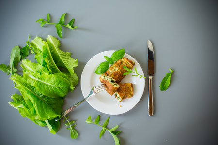 Protein omelette with greens on the table, top view.