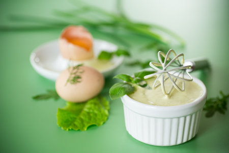 Green background and products for making fresh mayonnaise.の写真素材