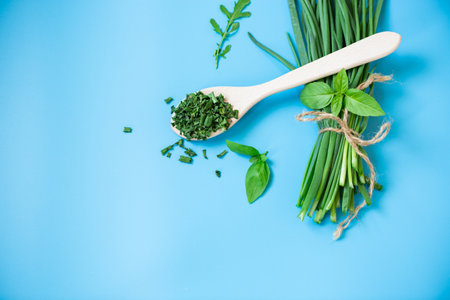 Preparing dried vegetables for winter in home kitchen on blue background.の写真素材