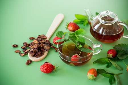 Delicious strawberry infusion in a teapot, top view.の写真素材