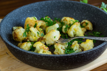 Top view of crispy cauliflower with parsley.の写真素材