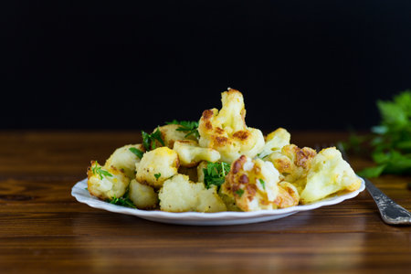 Vegetable dish of fried cauliflower with aromatic spices.の写真素材