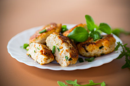Chicken cutlets fried until crusty on a brown background.の写真素材