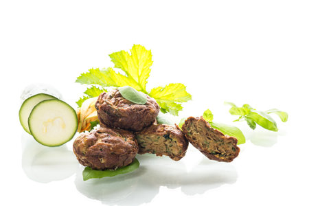 Homemade zucchini muffins on a white isolated background.の写真素材