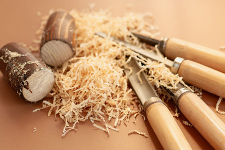 Wood carving close-up with sawdust.