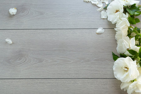 wooden light background with bright roses.の写真素材