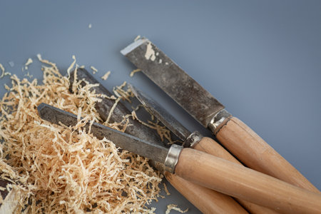 Shavings and wooden mallet on gray background.の写真素材