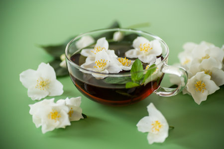 Green tea with jasmine in a glass teapot from above.の写真素材