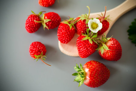 Appetizing red strawberries in a minimalistic composition.の写真素材